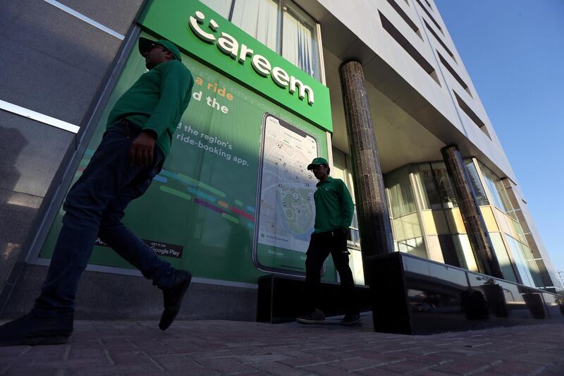 FILE PHOTO: Careem employees walk past the company headquarters in Dubai, UAE December 13, 2018. Picture taken December 13, 2018. REUTERS/Satish Kumar/File Photo