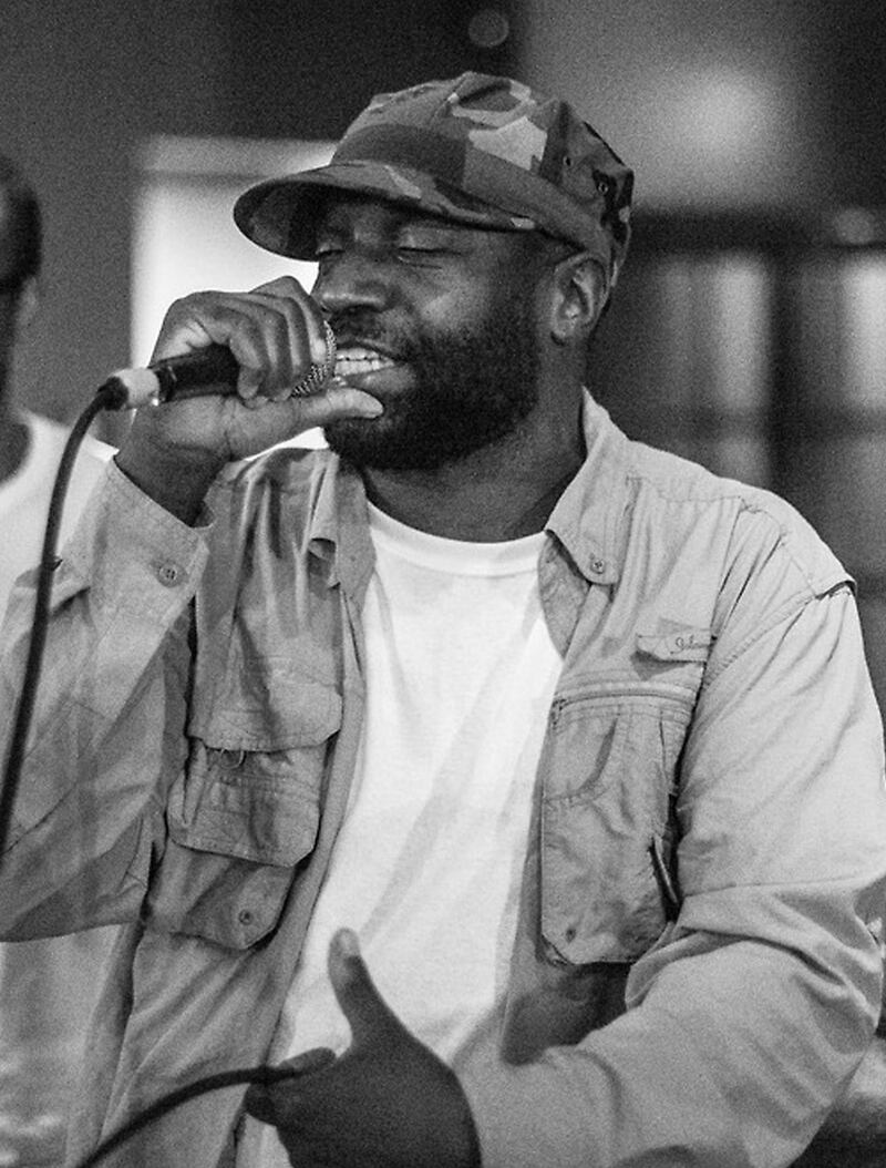 This image provided by @mpozitolbertphotography shows Malik B performing in studio.  The rapper and founding member of The Roots, has died. He was 47. The group announced the death of the Philadelphia-based emcee in a social media post Wednesday. The cause of death has not been released. Malik B, whose real name is Malik Abdul Basit, was a major contributor to the group, which includes Ahmir â€œQuestloveâ€ Thompson and Tariq â€œBlack Thoughtâ€ Trotter. He appeared on four albums before departing the group in 1999. In the following year, the Roots won their first Grammy. 
 (@mpozitolbertphotography via AP)