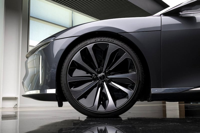 The front wheel of a Lucid Air prototype electric vehicle, manufactured by Lucid Motors Inc., is displayed at the company's headquarters in Newark, California, U.S., on Monday, Aug. 3, 2020. The final specs and design of the Lucid Air are due to be unveiled at an event in September and executives say customers can now expect delivery of the first batch of Airs in spring 2021. Photographer: David Paul Morris/Bloomberg