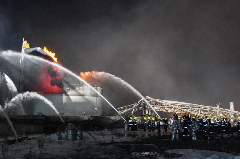 Firemen work following an explosion at a chemical plant. AFP