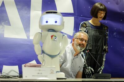 Aidan Meller presents Ai-Da, the first AI-powered robot artist, during the AI for Good summit. Getty 