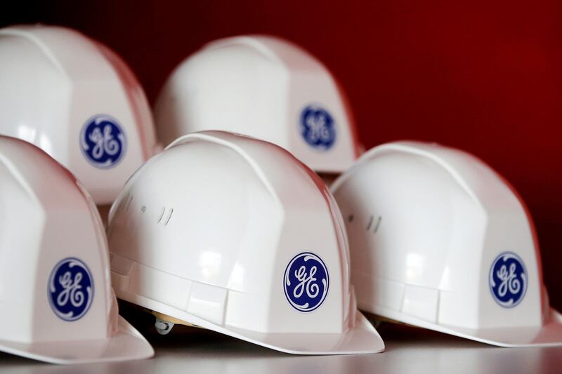 FILE PHOTO:  The General Electric logo is pictured on working helmets during a visit at the General Electric offshore wind turbine plant in Montoir-de-Bretagne, near Saint-Nazaire, western France, November 21, 2016.  REUTERS/Stephane Mahe/File Photo