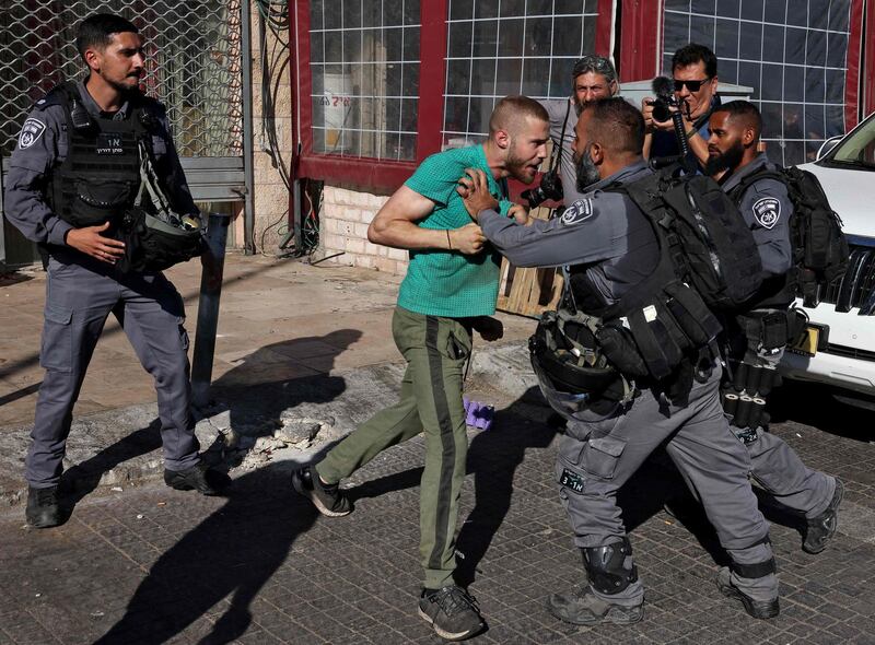A Palestinian man confronts members of the Israeli security forces in the Old City of Jerusalem. AFP
