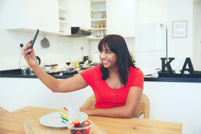 Celebration, Solo, Home, Apartment - Girl alone at home taking a selfie with a slice of cake