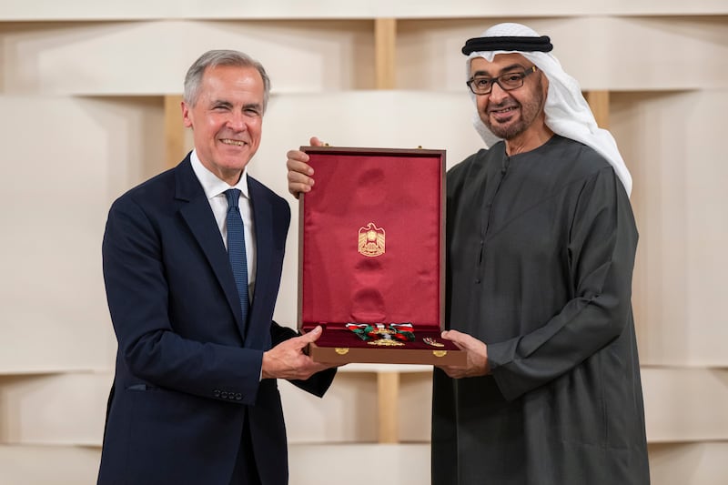 Sheikh Mohamed presents the First Class Order of Zayed II medal to Mark Carney, UN Special Envoy for Climate Action. Abdulla Al Neyadi / Presidential Court