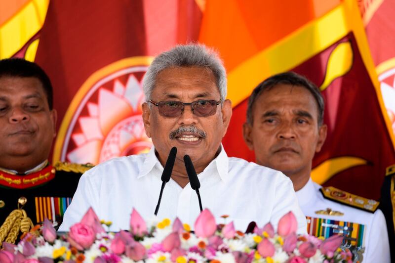 Sri Lanka's new president Gotabaya Rajapaksa (C) speaks after taking oath of office during his swearing-in ceremony at the Ruwanwelisaya temple in Anuradhapura on November 18, 2019. Sri Lanka's new president Gotabaya Rajapaksa was sworn in November 18 at a Buddhist temple revered by his core Sinhalese nationalist supporters, following an election victory that triggered fear and concern among the island's Tamil and Muslim minority communities. / AFP / Lakruwan WANNIARACHCHI
