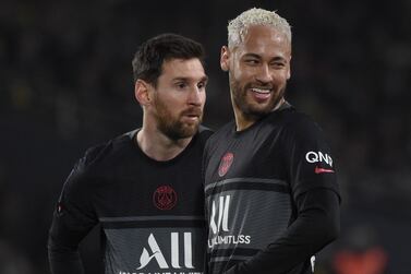 (FILES) In this file photo taken on February 19, 2022 Paris Saint-Germain's Argentinian forward Lionel Messi (L) and Paris Saint-Germain's Brazilian forward Neymar react during the French L1 football match between FC Nantes and Paris-Saint Germain (PSG) at the Stade de la Beaujoire–Louis Fonteneau, western France.  - Targets of criticism at PSG, Lionel Messi and Neymar are back in Argentina and Brazil.  Both teams, already qualified for Qatar 2022, appear to be the refuge of the pair of friends in the face of one of the worst sporting storms of their careers.  (Photo by Sebastien SALOM-GOMIS  /  AFP)