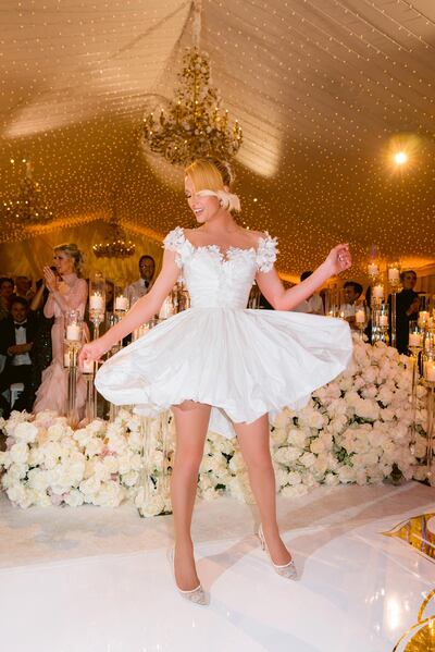 Her cocktail dress for the reception was also by Oscar de la Renta. Photo: Jose Villa / Shutterstock