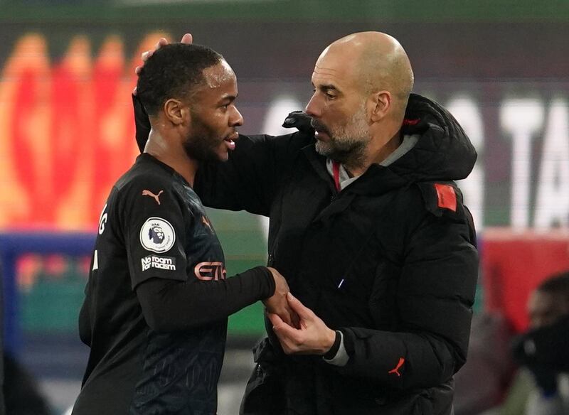 Manchester City manager Pep Guardiola with Raheem Sterling. EPA