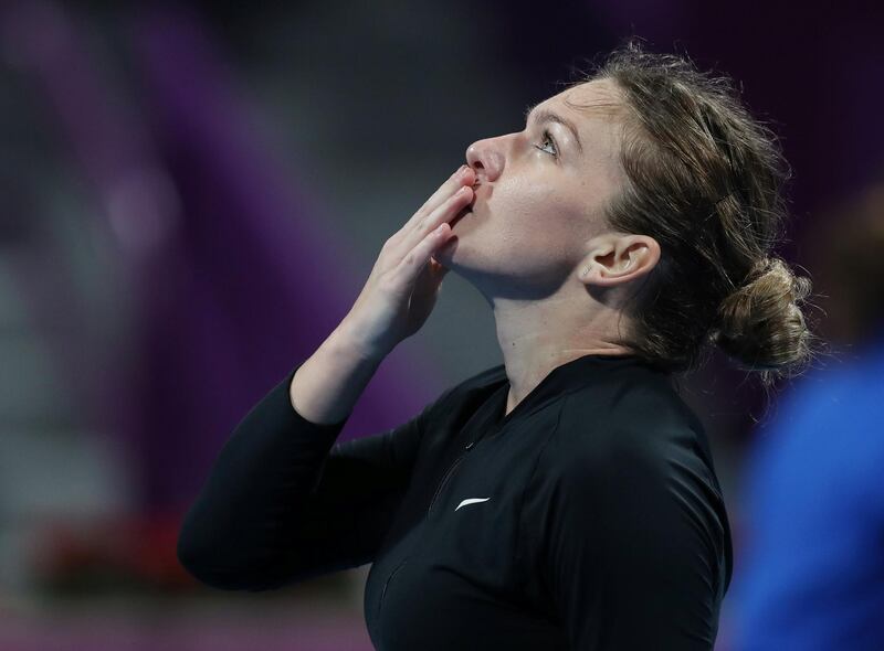 Tennis - WTA Premier 5 - Qatar Open - Khalifa International Tennis and Squash Complex, Doha, Qatar - February 14, 2019   Romania's Simona Halep celebrates winning her Quarter Final match against Germany's Julia Goerges   REUTERS/Ibraheem Al Omari