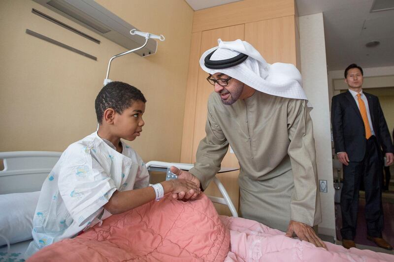 SEOUL, REPUBLIC OF KOREA (SOUTH KOREA) - February 27, 2014: HH General Sheikh Mohamed bin Zayed Al Nahyan Crown Prince of Abu Dhabi Deputy Supreme Commander of the UAE Armed Forces (C)
greets a young Emirati patient receiving treatment at Seoul Saint Mary's Hospital in the Republic of Korea. 
( Mohamed Al Hammadi / Crown Prince Court - Abu Dhabi )
---