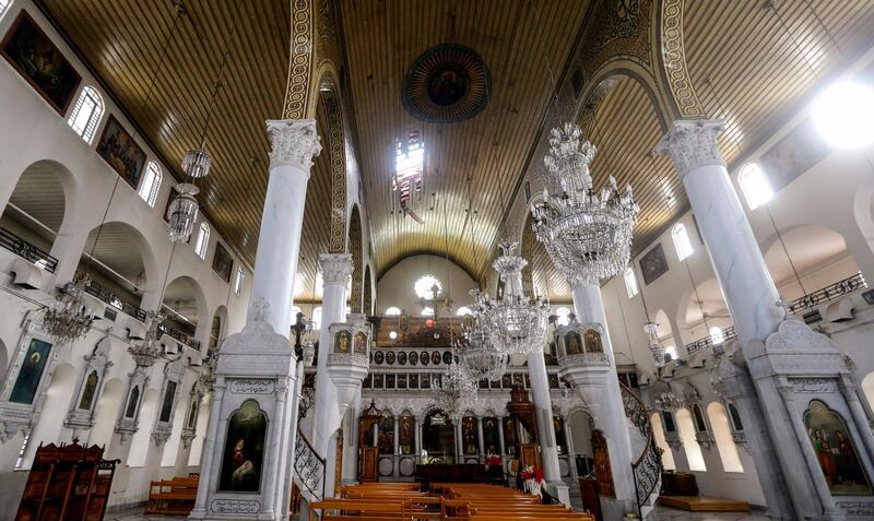 A picture taken on February 8, 2018 shows a view of the interior of the Mariamite Cathedral of Damascus, one of the oldest Greek Orthodox churches in the Syrian capital, and its pierced roof after being hit by a mortar shell in rebel bombardment that struck the eastern Bab Touma neighbourhood.
One woman was killed and four people were wounded in the Bab Touma mortar fire, a police source had said on February 6. / AFP PHOTO / LOUAI BESHARA