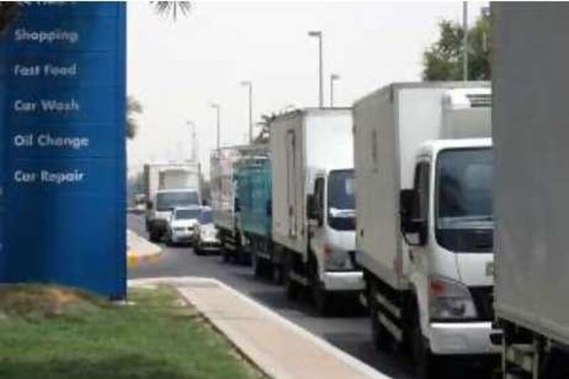 Abu Dhabi, UAE - July 06, 2008 - Truck drivers line up at Adnoc stations on Muroor Road, causing traffic congestion. They come from out of town to take advantage of cheaper gas prices (Nicole Hill / The National) *** Local Caption ***  NH Adnoc Traffic2.jpg