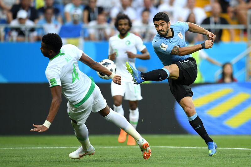 Luis Suarez of Uruguay shoots during the 2018 FIFA World Cup Russia group A match between Uruguay and Saudi Arabia. Matthias Hangst / Getty Images