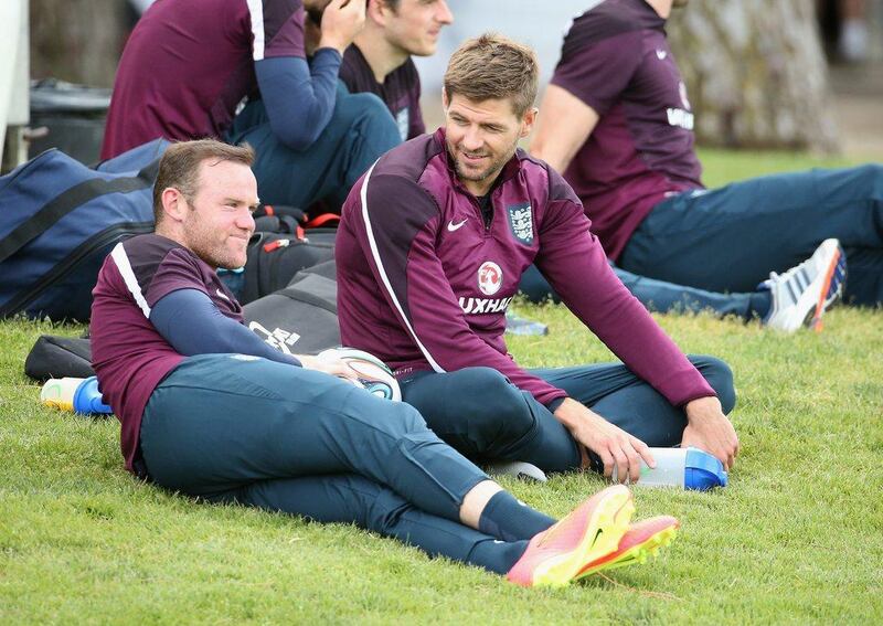 Wayne Rooney and Steven Gerrard look on during an England training session on Wednesday in Portugal. Richard Heathcote / Getty Images / May 21, 2014