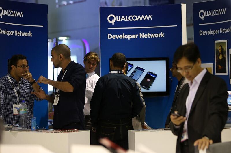 Visitors at the Qualcomm stall during the GITEX Technology Week held at Dubai World Trade Centre in Dubai. Pawan Singh / The National