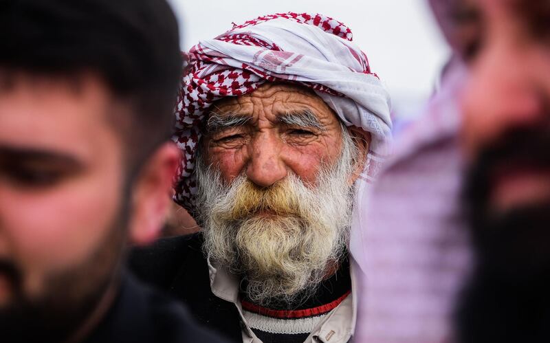 An elderly mourner attends a mass funeral for Yazidi victims of ISIS in the northern Iraqi village of Kocho in Sinjar district. AFP