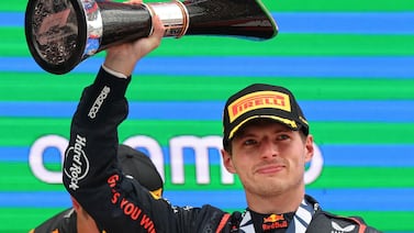 TOPSHOT - Red Bull's Dutch driver Max Verstappen celebrates on the podium winning the Spanish Formula One Grand Prix at the Circuit de Catalunya on June 23, 2024 in Montmelo, on the outskirts of Barcelona.  (Photo by Thomas COEX  /  AFP)