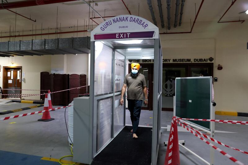 DUBAI, UNITED ARAB EMIRATES , June 30 – 2020 :- Human sanitizing tunnel installed for the visitors as a preventive measure against the spread of the coronavirus at the Gurunanak Darbar in Jebel Ali in Dubai. Places of worship opening up tomorrow in the UAE. (Pawan Singh / The National) For News. Story by Ramola