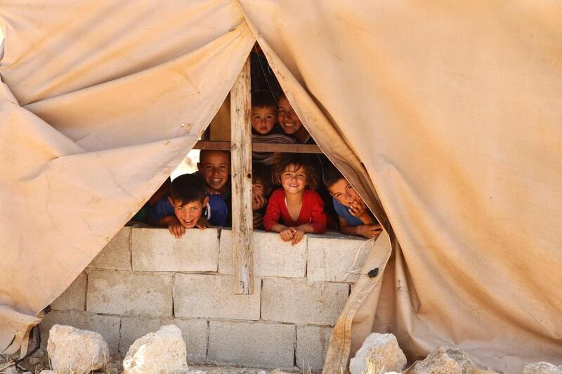 Palestinian children pictured at Khirbet Zanuta in the Hebron hills. Hazem Bader / AFP