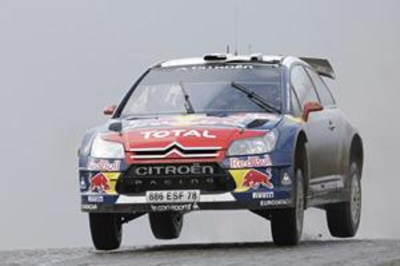 Sebastien Loeb on his way to victory at the Rally of great Britain in Cardiff, Wales, to claim his sixth consecutive WRC drivers' title.