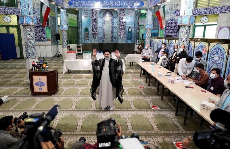 Iranian presidential candidate Ebrahim Raisi waves after casting his ballot for presidential election, in Tehran. AFP