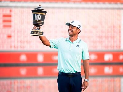 Xander Schauffele poses with the trophy after winning the WGC-HSBC Champions golf tournament in Shanghai. AFP