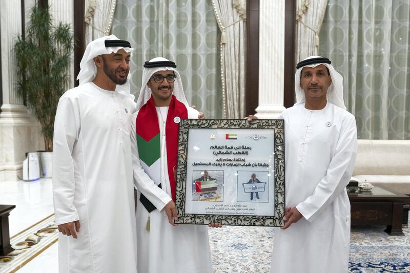 ABU DHABI, UNITED ARAB EMIRATES - June 11, 2018: HH Sheikh Mohamed bin Zayed Al Nahyan Crown Prince of Abu Dhabi Deputy Supreme Commander of the UAE Armed Forces (L) receives Abdullah Mohamed Nasser Al Ahbabi, the youngest Arab to reach the North Pole (2nd L), during an iftar reception.
��(��Mohamed Al Hammadi / Crown Prince Court - Abu Dhabi )
---