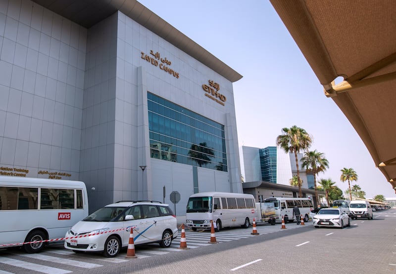 Etihad recruits wait for their bus outside the aviation training centre. Victor Besa / The National
