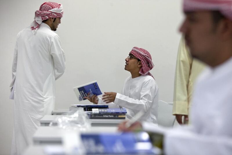 Nuclear technology major student Fahad Ahmed Mohammed, centre, talks to a fellow classmate after their first physics class at Khalifa University in Abu Dhabi. The transition from education to work can be difficult for some students. Silvia Razgova / The National