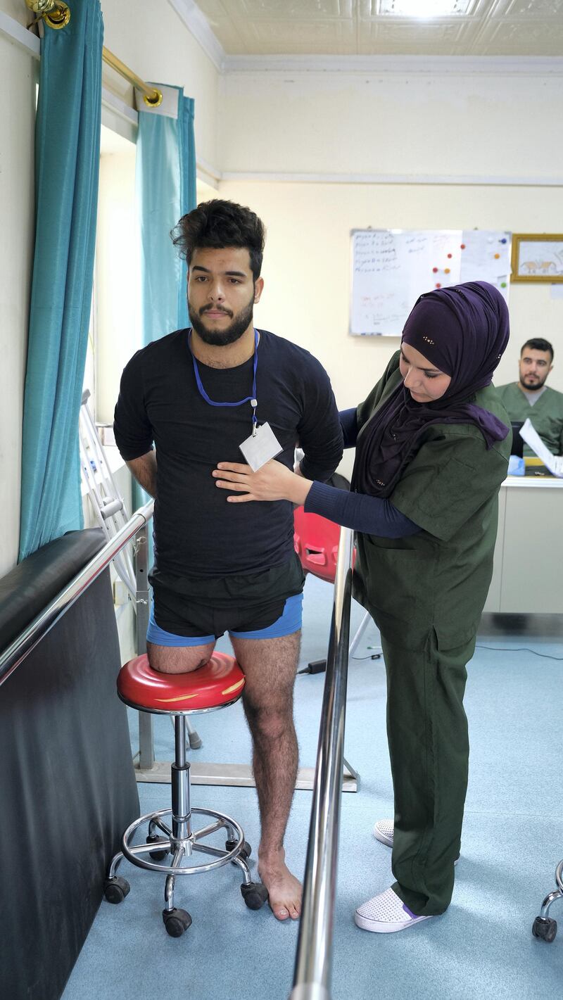 Seif Salman receives physiotherapy ahead of being cast for a prosthetic limb, after loosing his leg in protests in Baghdad last year. Ameer Hazim for The National