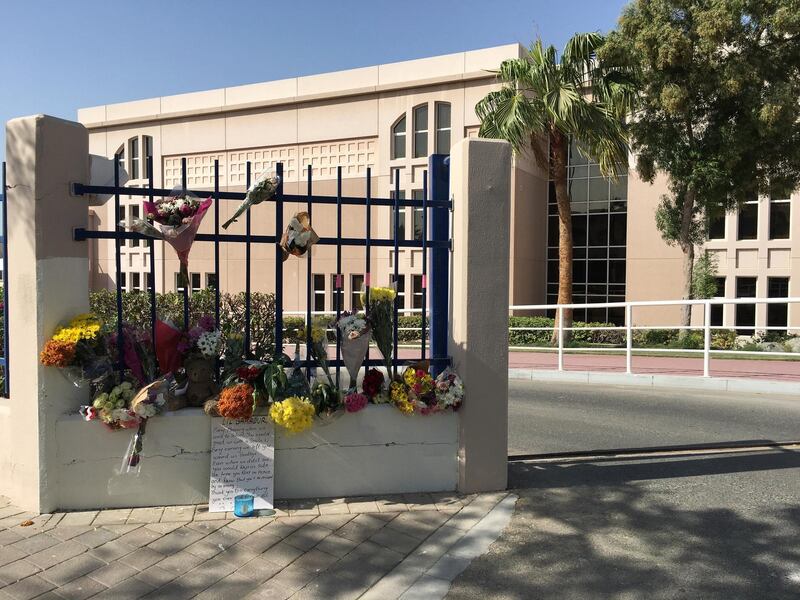 Flowers have been left outside the gates of the school. Antonie Robertson / The National