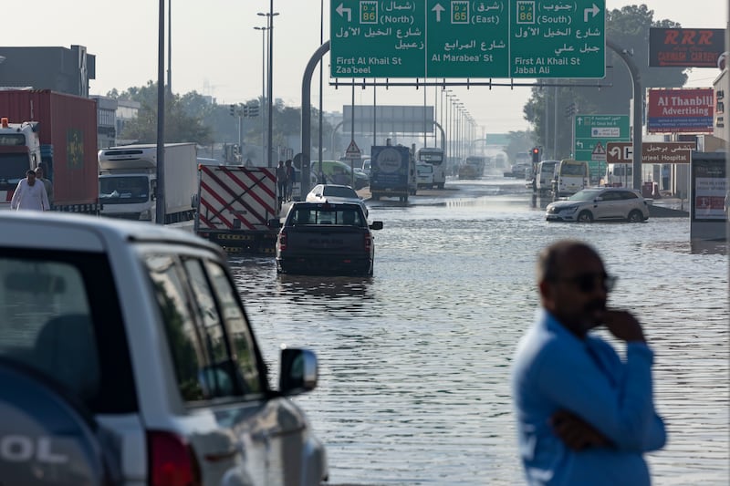 The D65 exit from Sheikh Zayed Road in Al Quoz, Dubai, remains flooded, with some cars still abandoned. Antonie Robertson / The National