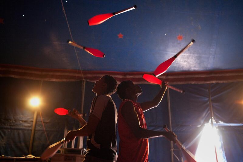 Abu Dhabi, United Arab Emirates, April 29, 2013: 
Ethiopian jugglers (L) Nebyu Almerew, 20, and (R) Milkyas Asfaw, 24, practice their craft backstage before their next performance on Monday, April 29, 2013, at the Monte Carlo circus' temporary location in Mussafah, an industrial subsection of Abu Dhabi. 
Silvia Razgova / The National
