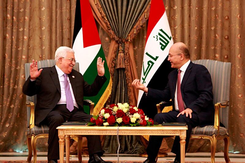 Iraqi President Barham Salih, right, meets with visiting Palestinian President Mahmoud Abbas at Salam Palace in Baghdad, Iraq, Monday, March 4, 2019. (AP Photo/Hadi Mizban)