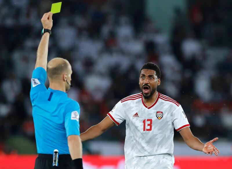Referee Adham Makhadmah gives yellow card to Ismaeel. AP Photo