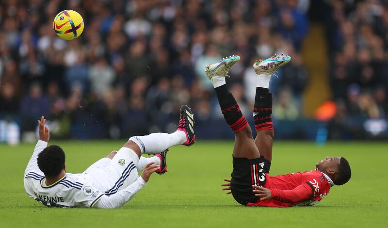 Leeds United's Weston McKennie and Manchester United's Tyrell Malacia. Reuters