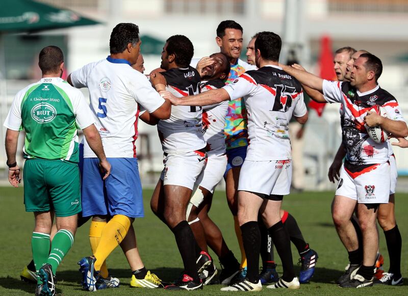 Dubai, United Arab Emirates - December 1st, 2017: Former French international Serge Betsen of SBA Pirates gets a hand to the face after a fight breaks out during the game between Christina Noble Children's Foundation and SBA Pirates at the 2nd Day of Dubai Rugby 7's. Friday, December 1st, 2017 at The Sevens, Dubai. Chris Whiteoak / The National