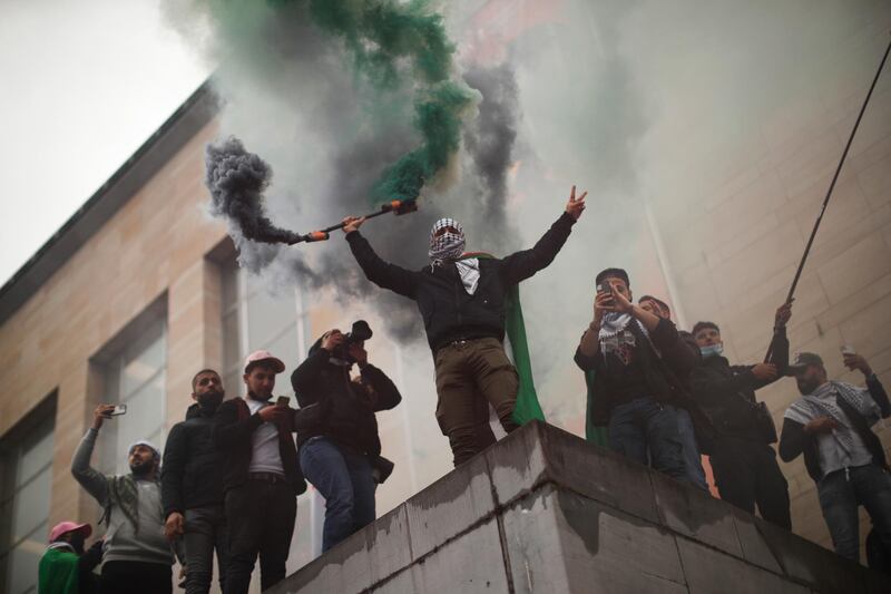 Flares are set off during a protest in Brussels, Belgium, in support of Palestinians in the Gaza Strip. AP Photo