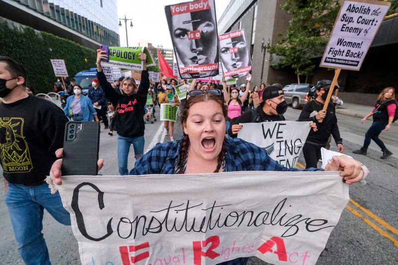 Demonstrators march in the streets after protesting outside of the US Courthouse in Los Angeles, California, after a draft of the court's decision was released several weeks ago. AP