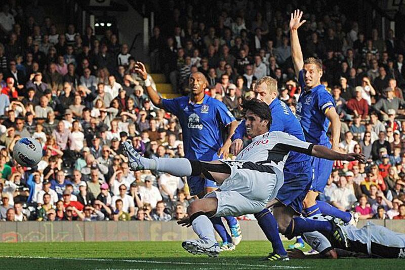 Bryan Ruiz, the Fulham forward, equalises for the London club against Everton, but the Toffees woudl score twice in injury time to seal a 3-1 win.

Ben Stansall / AFP