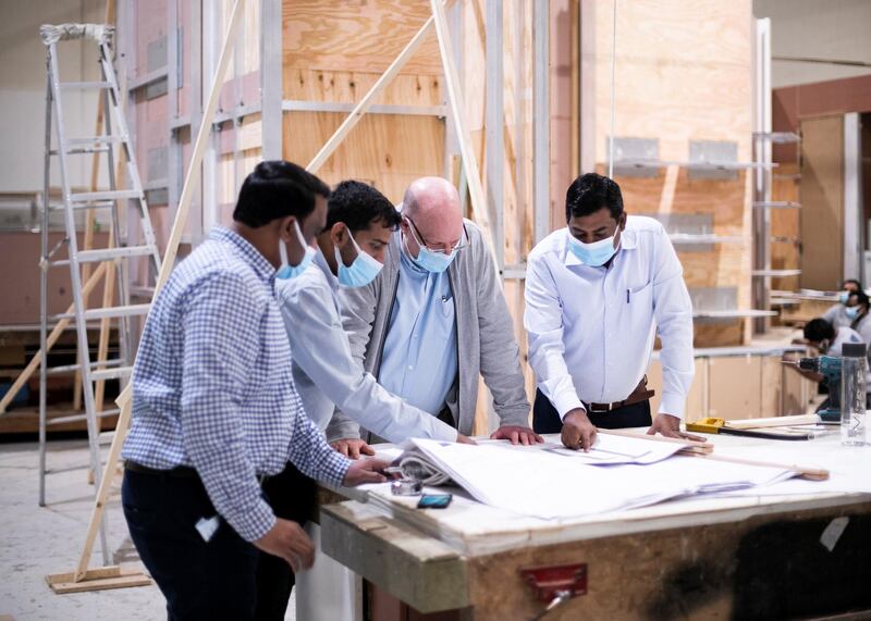 DUBAI, UNITED ARAB EMIRATES. 25 January 2021.
Hugh Bigley, second to right, Managing Director, Deco Emirates. Deco Emirates Deco Emirates has inoculated a big percentage of their staff in drive to vaccinate all on site. (Photo: Reem Mohammed/The National)

Reporter:
Section: