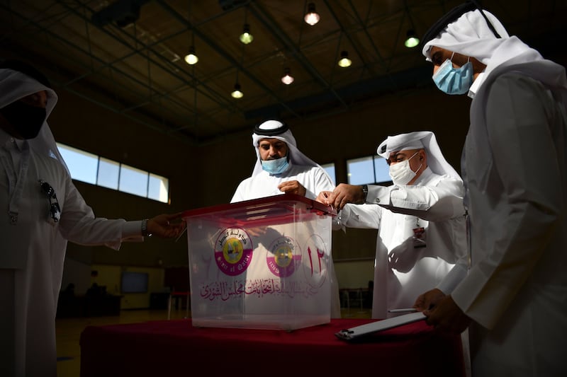 Qatari men cast their votes. Reuters