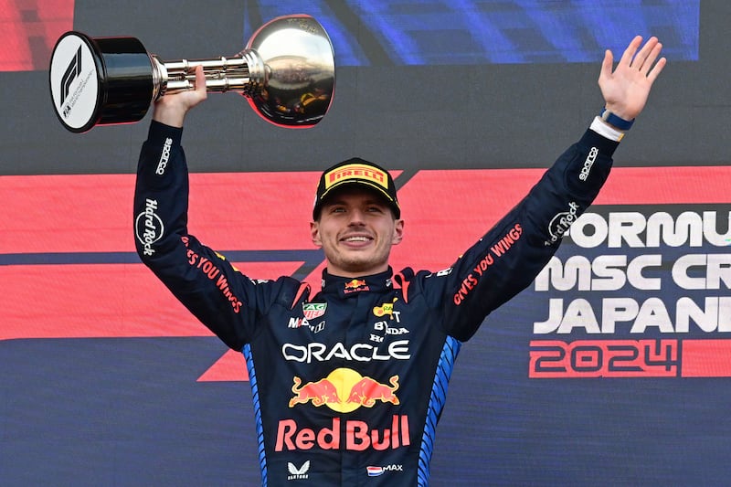 Red Bull's Max Verstappen on the podium after winning the Japanese Grand Prix at the Suzuka circuit on Sunday, April 7, 2024. AFP