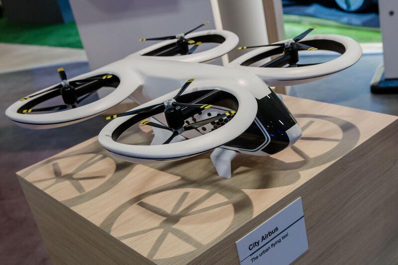 A model of a City Airbus flying taxi, developed by Airbus SE, sits on the company's stand during the Viva Technology conference in Paris, France, on Thursday, May 24, 2018. Viva Tech, a three-year-old event for startups, gathers global technology leaders and entrepreneurs as the French establishment unites behind a push for more tech investment in Paris. Photographer: Marlene Awaad/Bloomberg