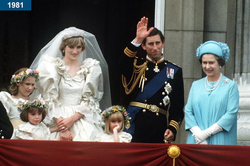 1981: The Prince and Princess of Wales pose on the balcony of Buckingham Palace on their wedding day, with the queen.