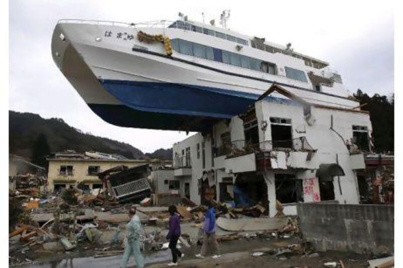 A boat sits on top of a building in Otsuchi, Japan 11 days after the earthquake and tsunami which devastated a vast area of the country's northeastern Pacific coast.