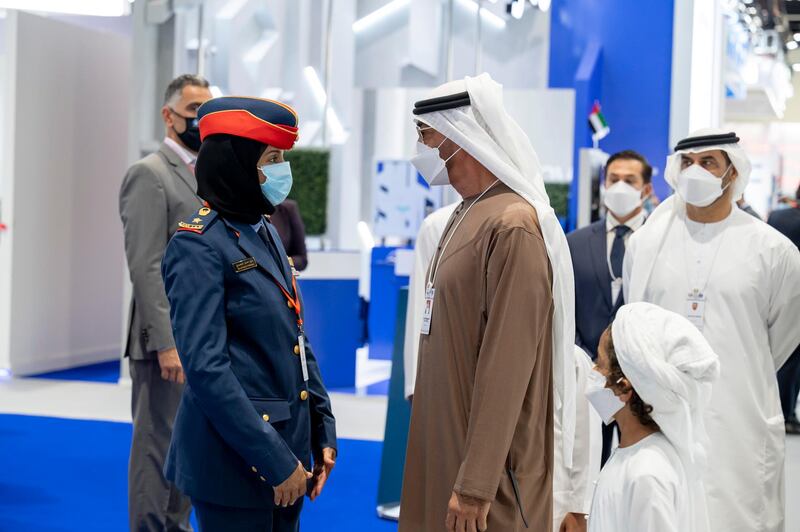 ABU DHABI, UNITED ARAB EMIRATES - February 24, 2021: HH Sheikh Mohamed bin Zayed Al Nahyan, Crown Prince of Abu Dhabi and Deputy Supreme Commander of the UAE Armed Forces (2nd L) speaks with Major Pilot Mariam Al Mansouri (L) during a tour at the International Defence Exhibition and Conference (IDEX), at ADNEC.

( Hamad Al Kaabi / Ministry of Presidential Affairs )​
---