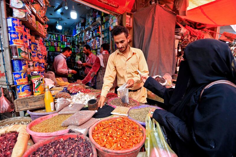 A Yemeni vendor sells grain in Sanaa. AFP