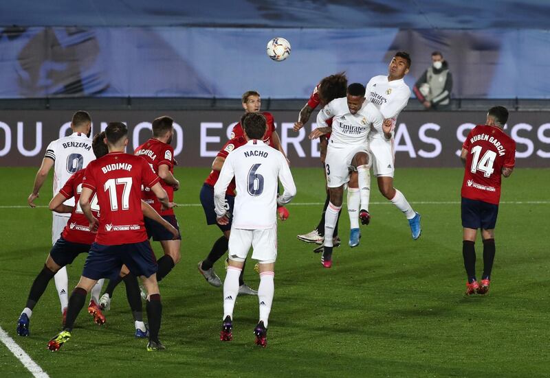 Real's Eder Militao heads home their first goal. Reuters